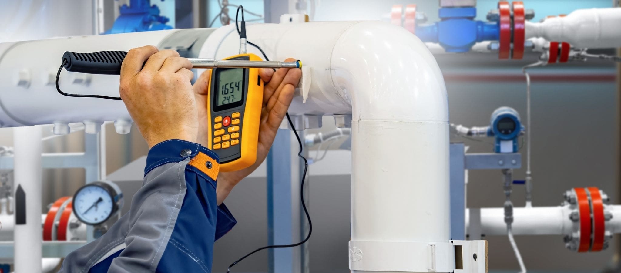 An engineer tests and calibrates temperature measurement equipment